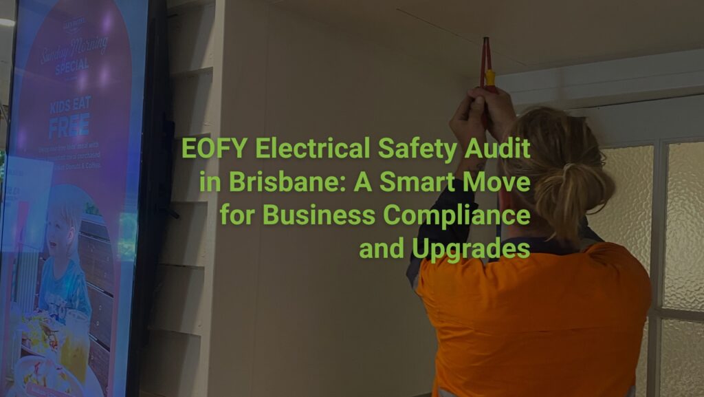 Licensed electrician performing an electrical safety audit in a Brisbane commercial building